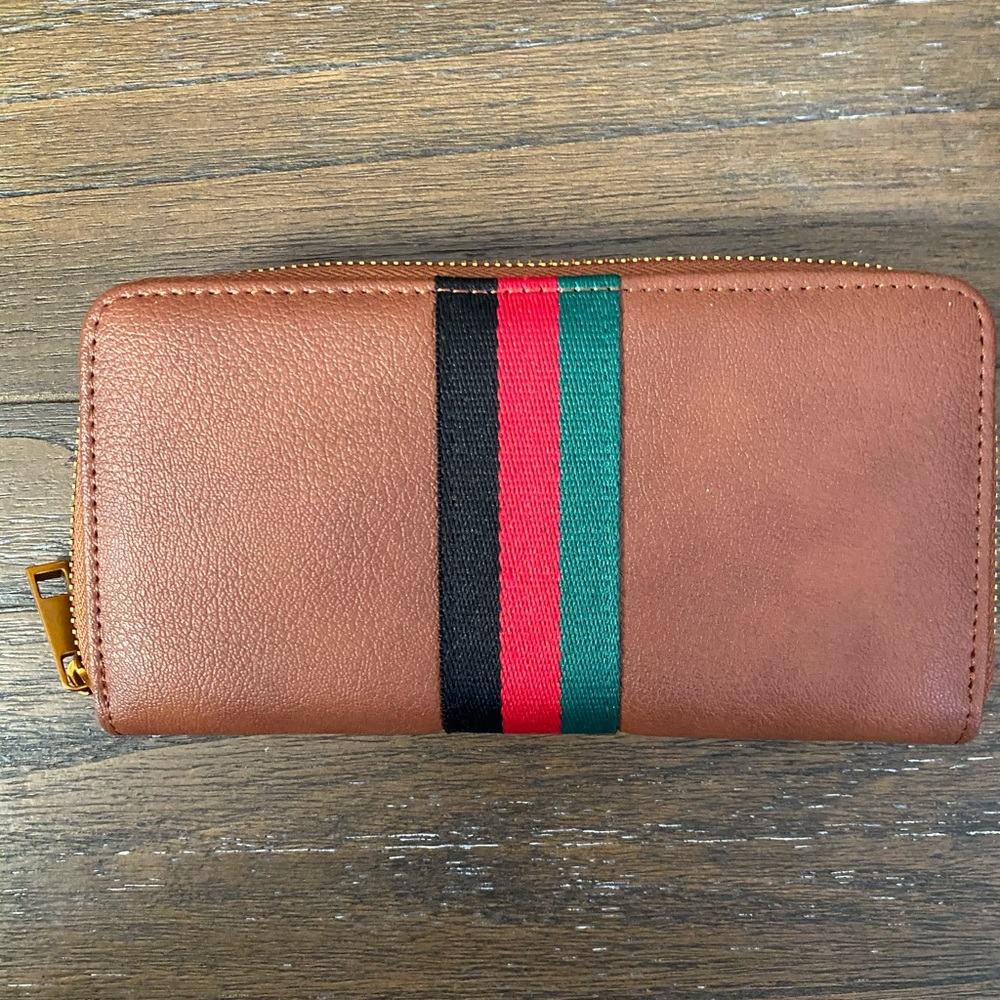 Brand new ladies wallet with red, black, and green stripe down center